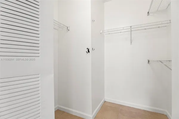 a bathroom with a granite countertop sink a toilet and a bathtub