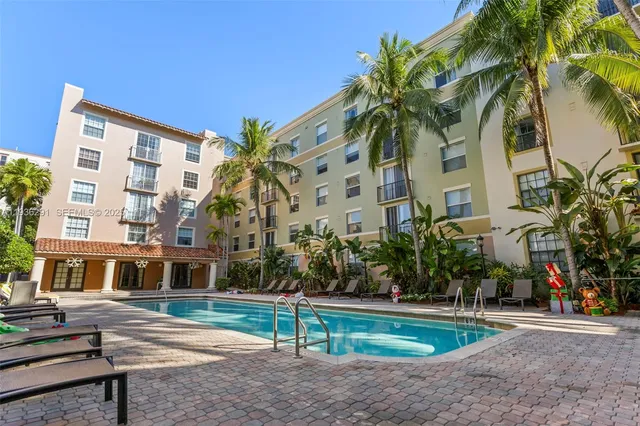 a view of a swimming pool with a patio