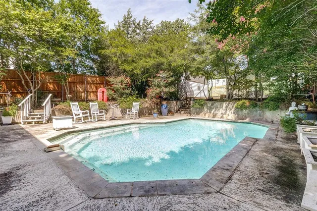a view of a swimming pool with a patio