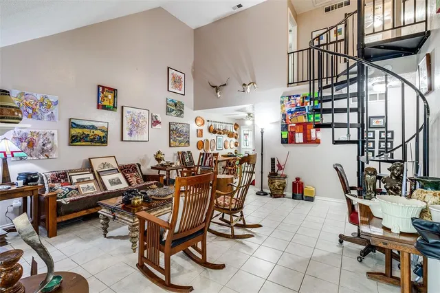 a living room with lots of furniture and a dining table