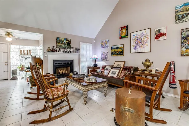 a living room with furniture a fireplace and a table