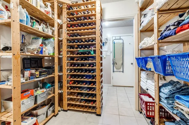 a utility room with lots of different colored cloths