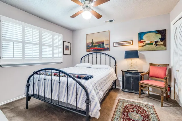 a bedroom with furniture and a window