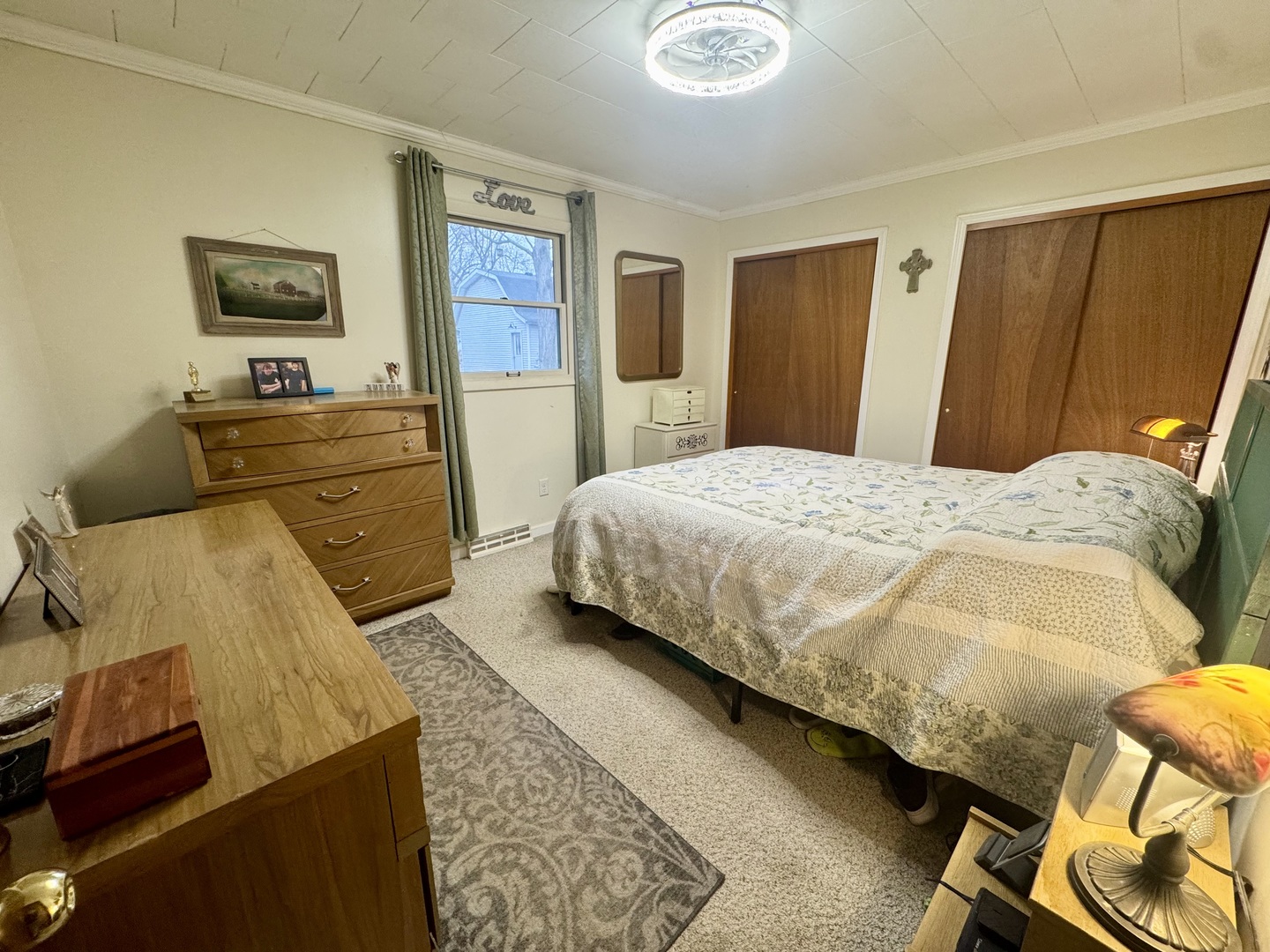 206 East Warren Street Le Roy, IL 61752 - Photo 11 of 18 a bedroom with a bed and wooden floor