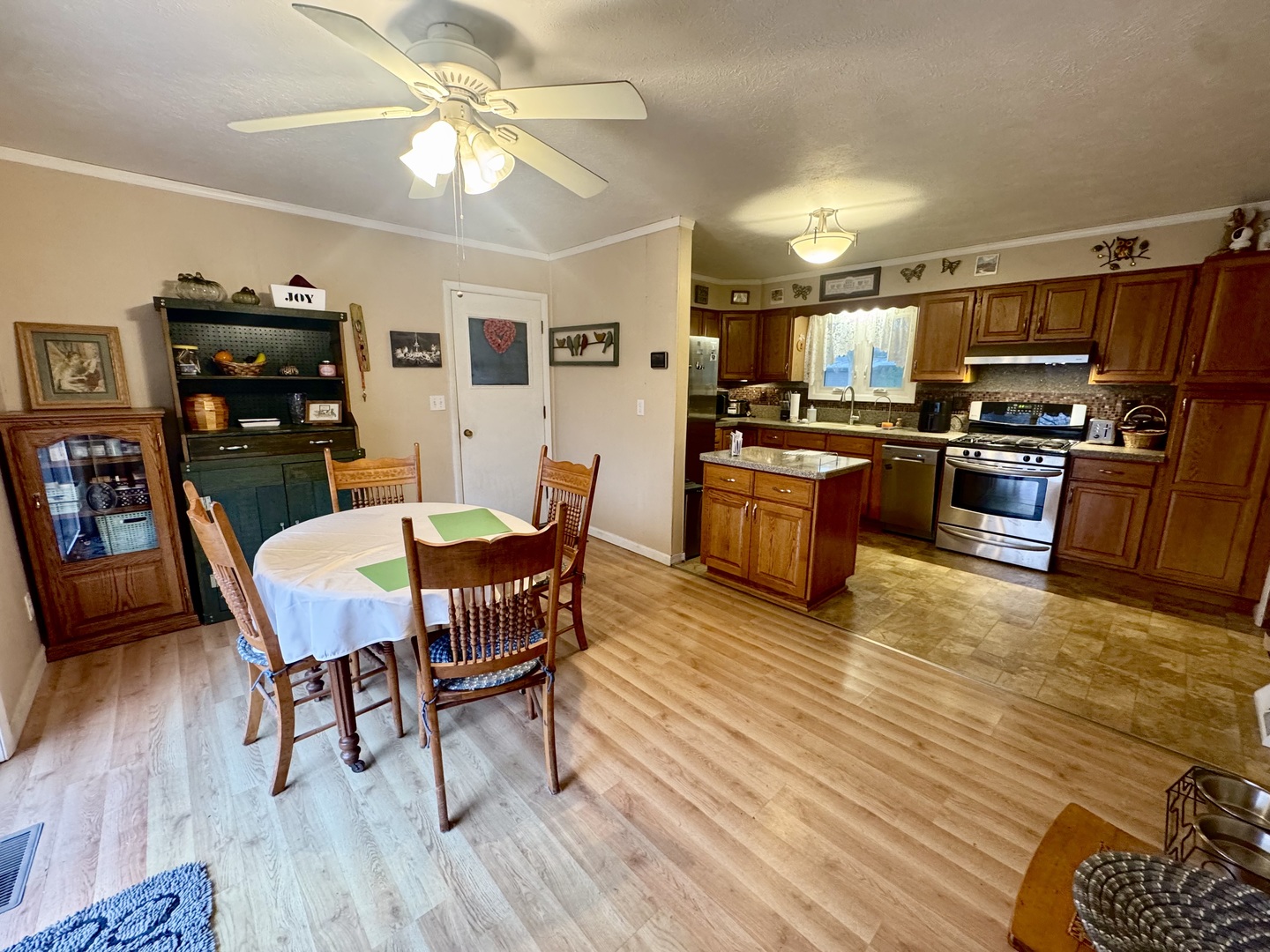 206 East Warren Street Le Roy, IL 61752 - Photo 8 of 18 a view of a dining room with furniture a rug and wooden floor