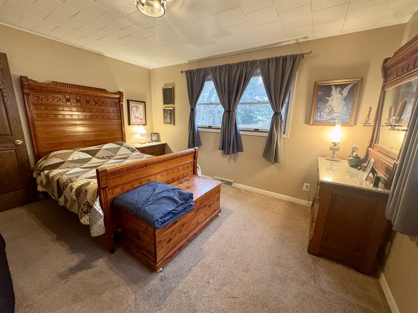 206 East Warren Street Le Roy, IL 61752 - Photo 9 of 18 a bed room with a bed and a large window