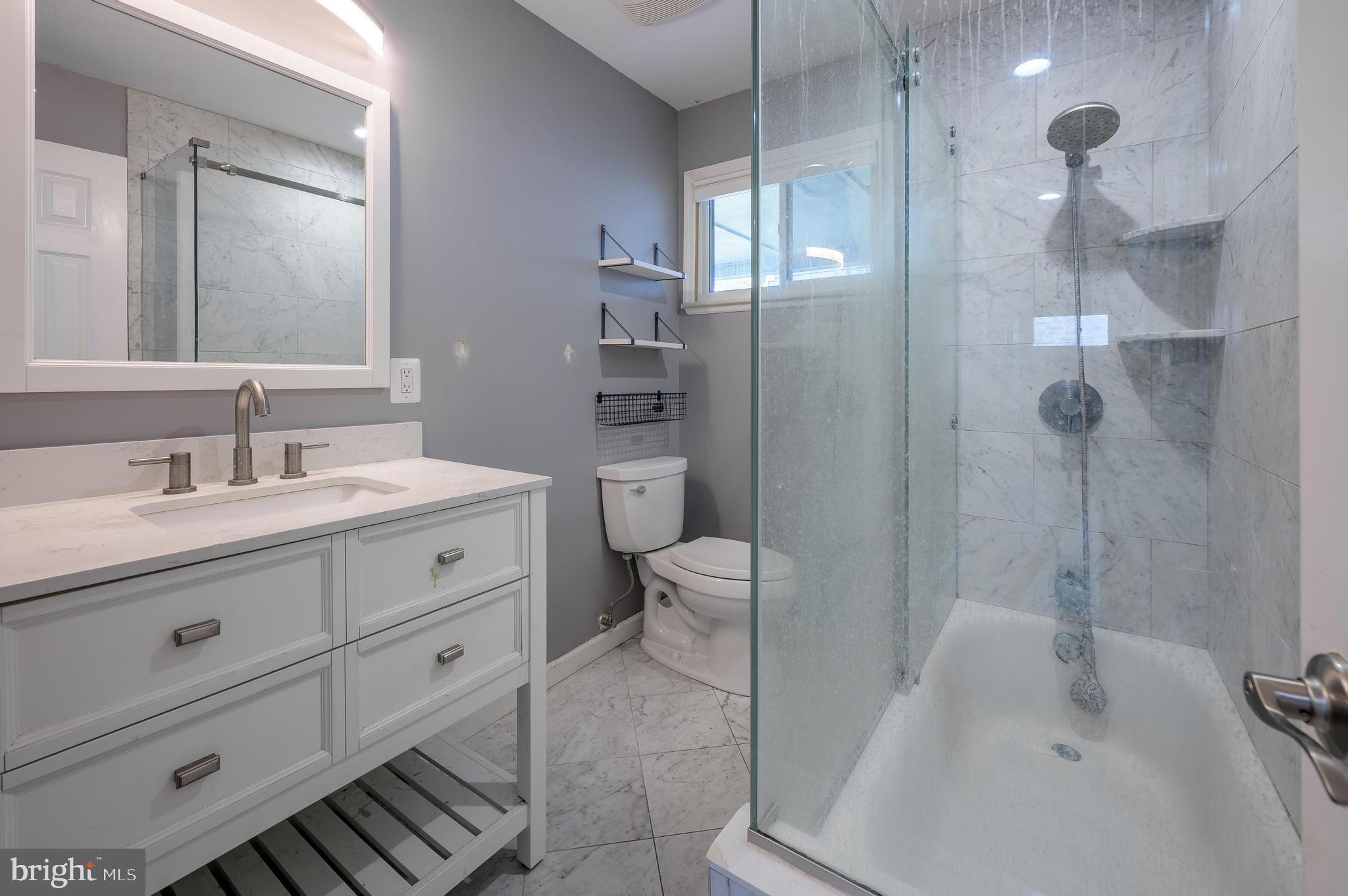 26 Hemlock Drive Parlin, NJ 08859 - Photo 5 of 17 a bathroom with a sink a toilet and shower