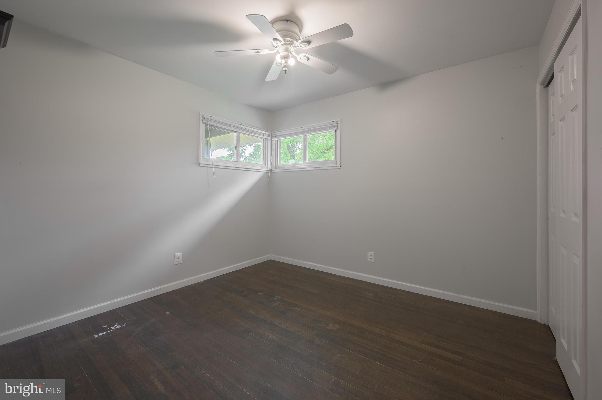 26 Hemlock Drive Parlin, NJ 08859 - Photo 8 of 17 wooden floor in an empty room with a window