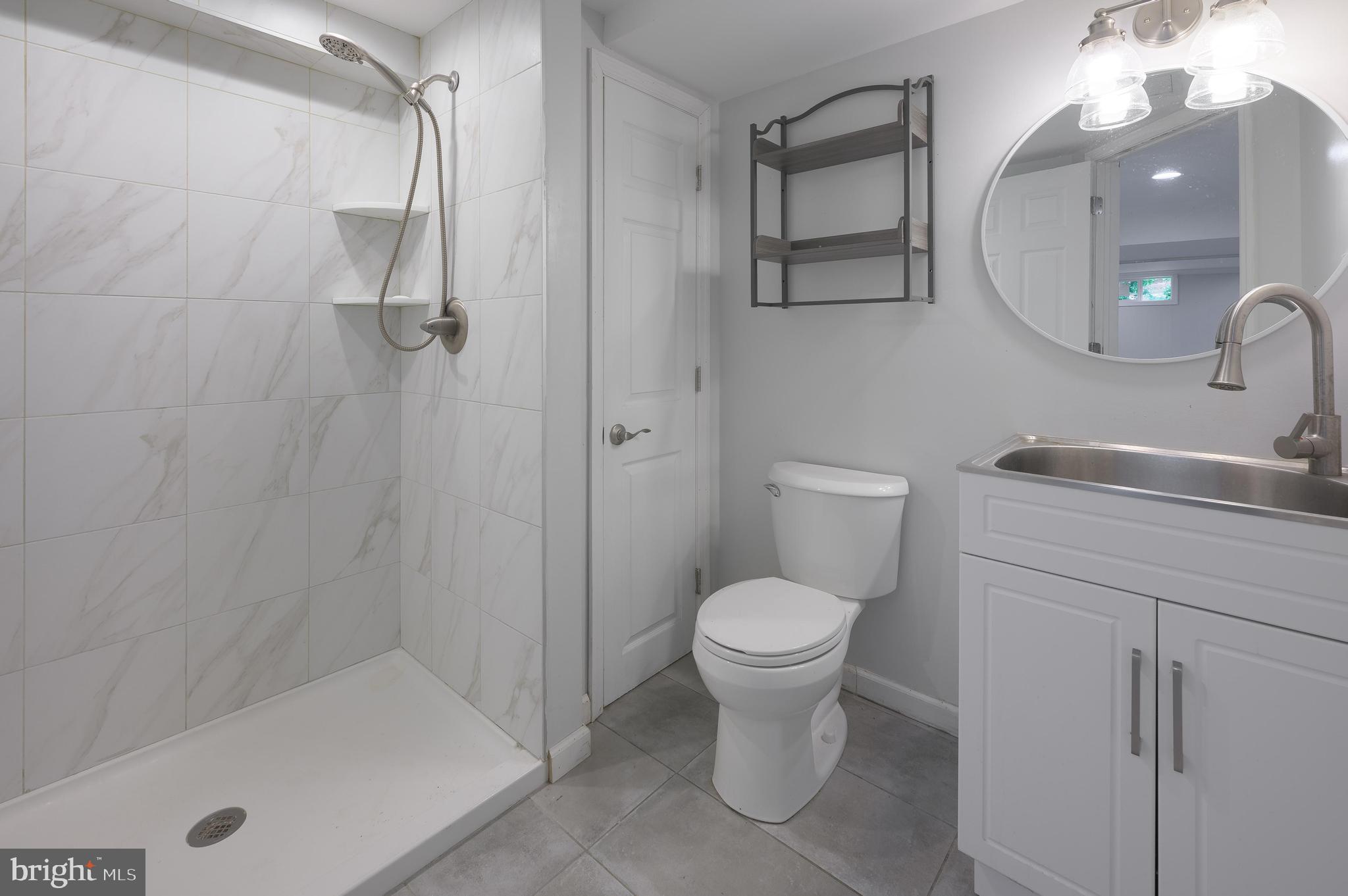 26 Hemlock Drive Parlin, NJ 08859 - Photo 9 of 17 a bathroom with a sink toilet and shower