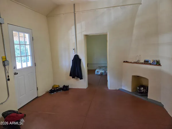 a view of livingroom with furniture and a fireplace
