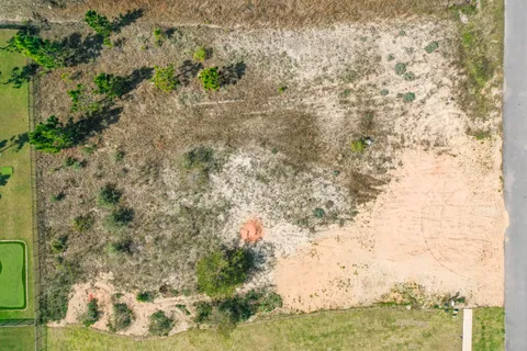 an aerial view of residential building with parking space