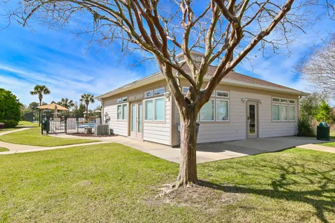 a view of a swimming pool with outdoor seating