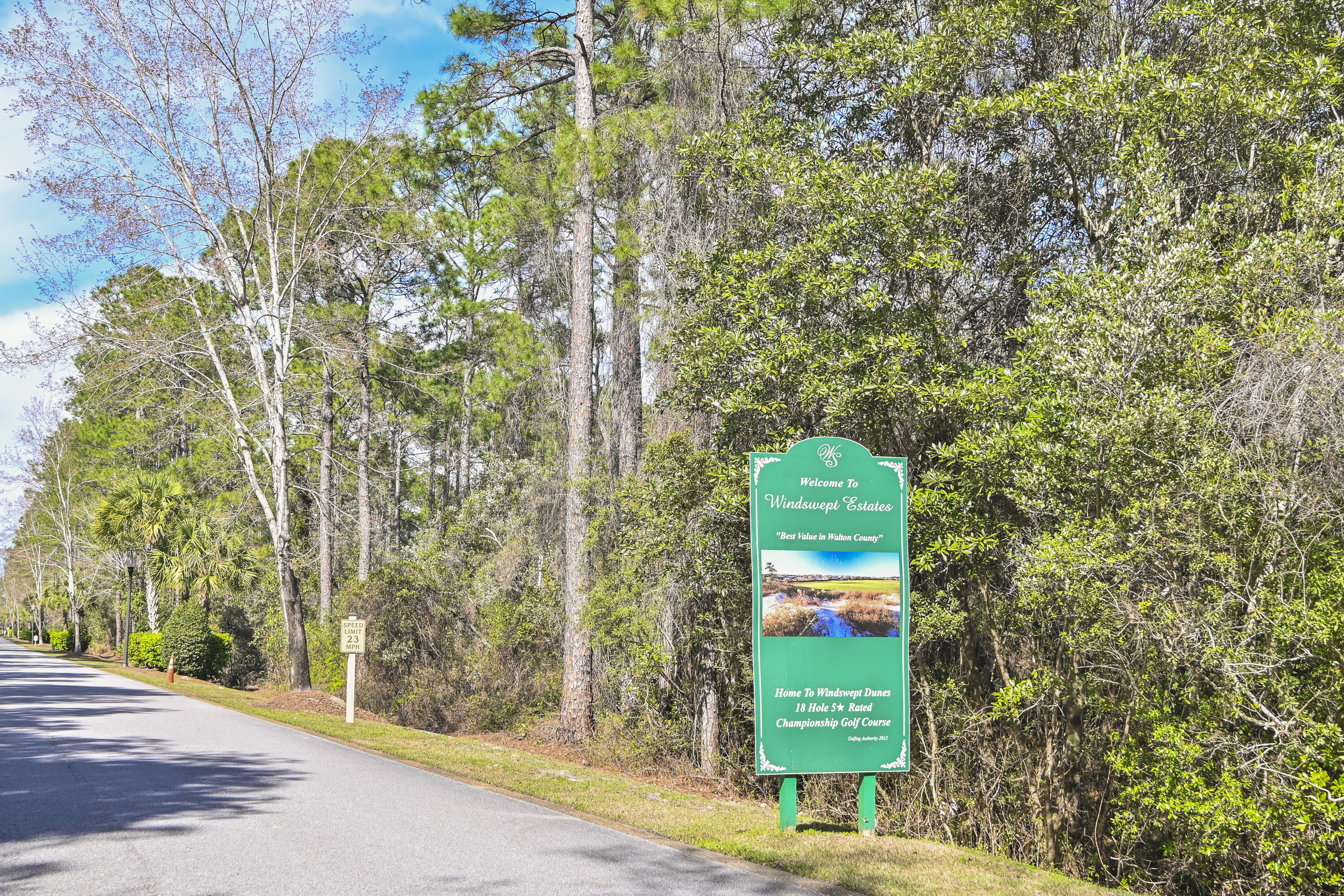 379 Fairway Crossing Freeport, FL 32439 - Photo 4 of 32 a green field with lots of trees in the background