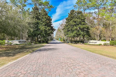 a view of swimming pool with trees