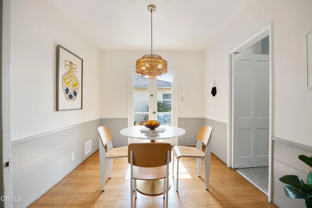 1766 Whitefield Road Pasadena, CA 91104 - Photo 14 of 52 a dining room with furniture a rug and wooden floor