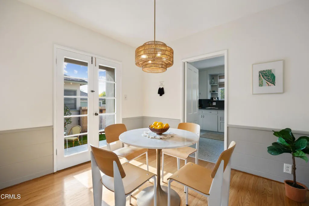 1766 Whitefield Road Pasadena, CA 91104 - Photo 15 of 52 a dining room with furniture potted plants and wooden floor