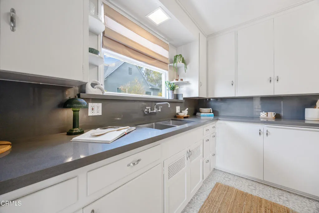 1766 Whitefield Road Pasadena, CA 91104 - Photo 21 of 52 a kitchen with granite countertop white cabinets white appliances and a wide window