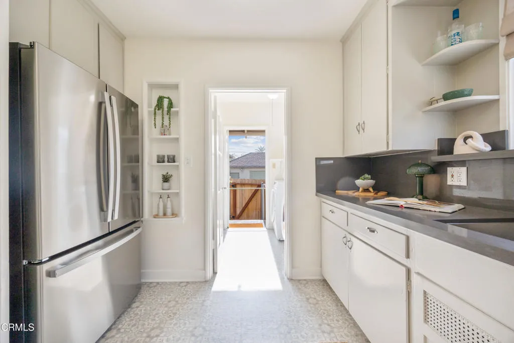 1766 Whitefield Road Pasadena, CA 91104 - Photo 25 of 52 a kitchen with stainless steel appliances a refrigerator and cabinets