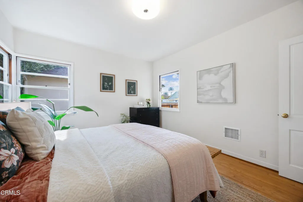 1766 Whitefield Road Pasadena, CA 91104 - Photo 33 of 52 a bedroom with a bed and wooden floor