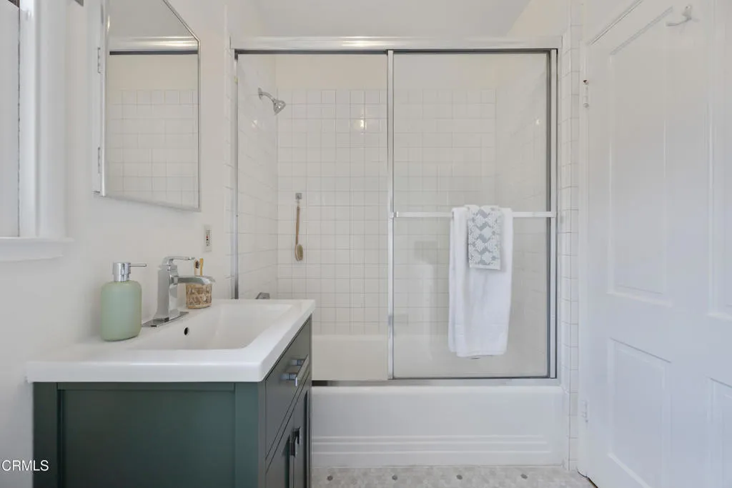 1766 Whitefield Road Pasadena, CA 91104 - Photo 38 of 52 a bathroom with a sink a mirror and shower