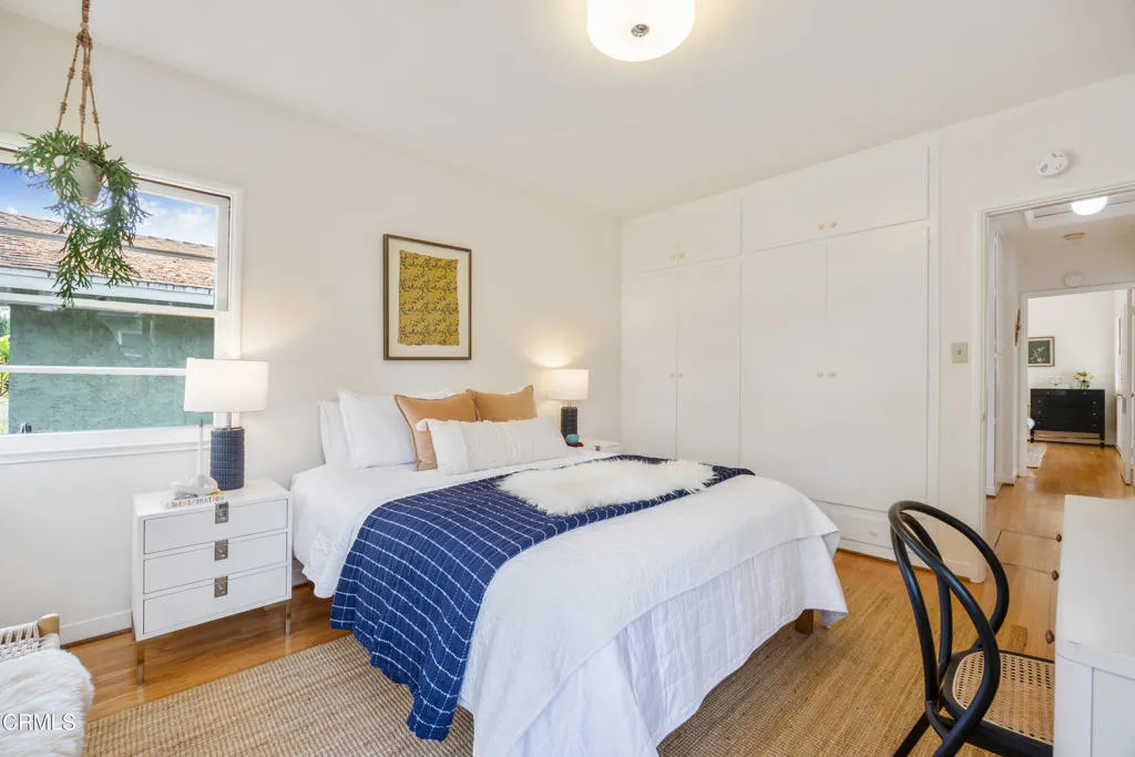 1766 Whitefield Road Pasadena, CA 91104 - Photo 42 of 52 a bedroom with a bed and wooden floor