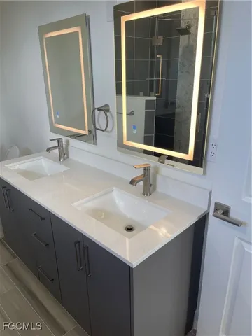a bathroom with a sink and a mirror