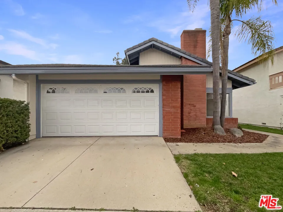 a front view of a house with garage