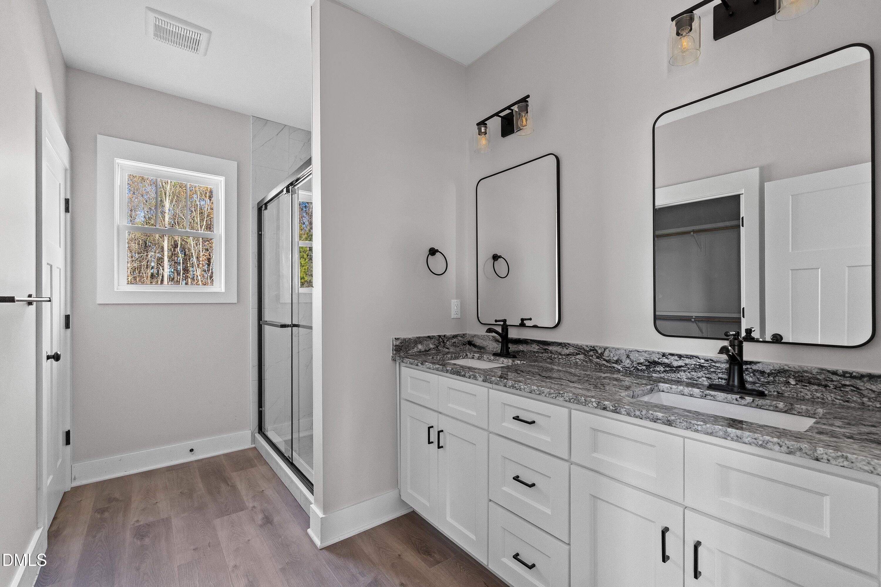 9400 Turkey Way Middlesex, NC 27557 - Photo 15 of 31 a bathroom with a granite countertop sink double and mirror