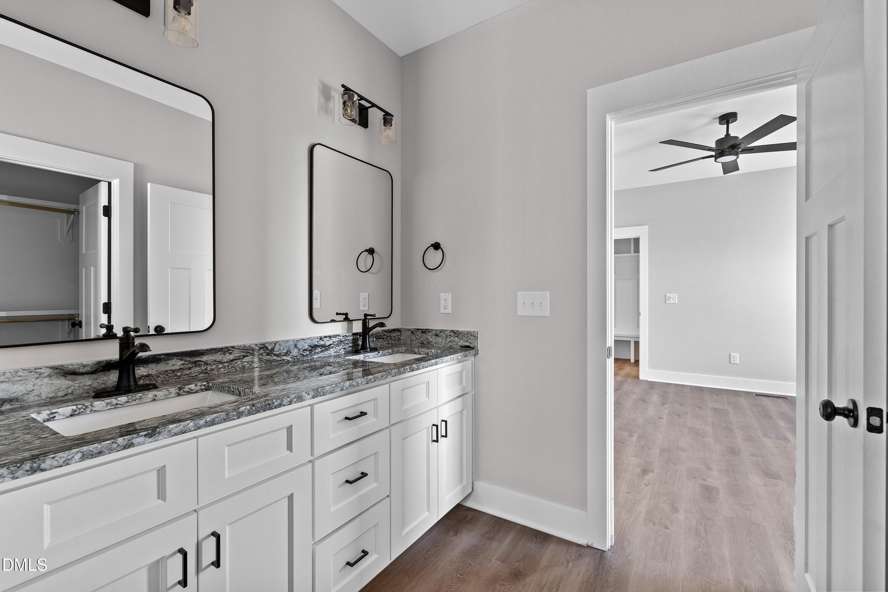 9400 Turkey Way Middlesex, NC 27557 - Photo 16 of 31 a bathroom with a granite countertop sink and a mirror