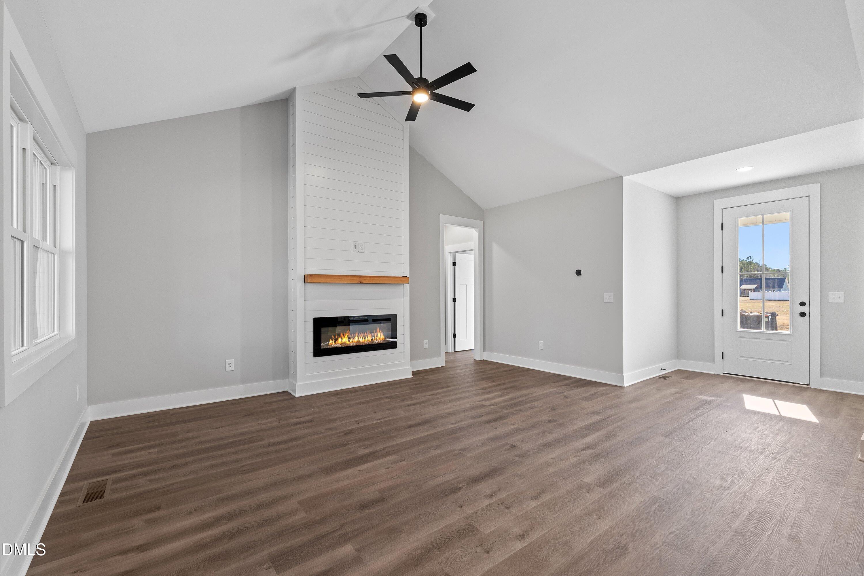 9400 Turkey Way Middlesex, NC 27557 - Photo 2 of 31 a view of an empty room with a fireplace and a window