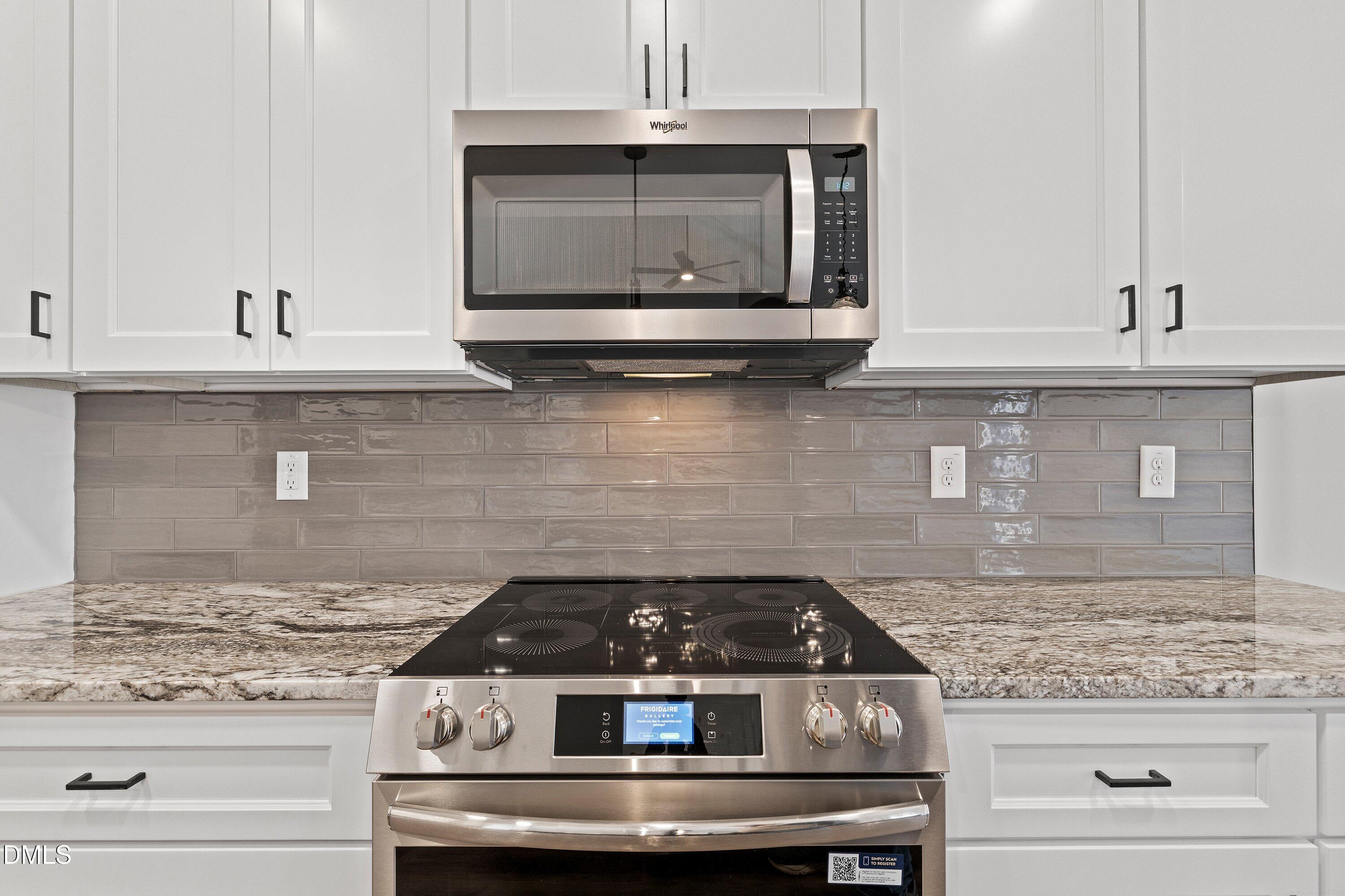 9400 Turkey Way Middlesex, NC 27557 - Photo 8 of 31 a stove top oven sitting inside of a kitchen and granite counter tops
