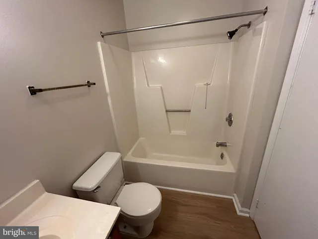 a bathroom with a toilet and a sink