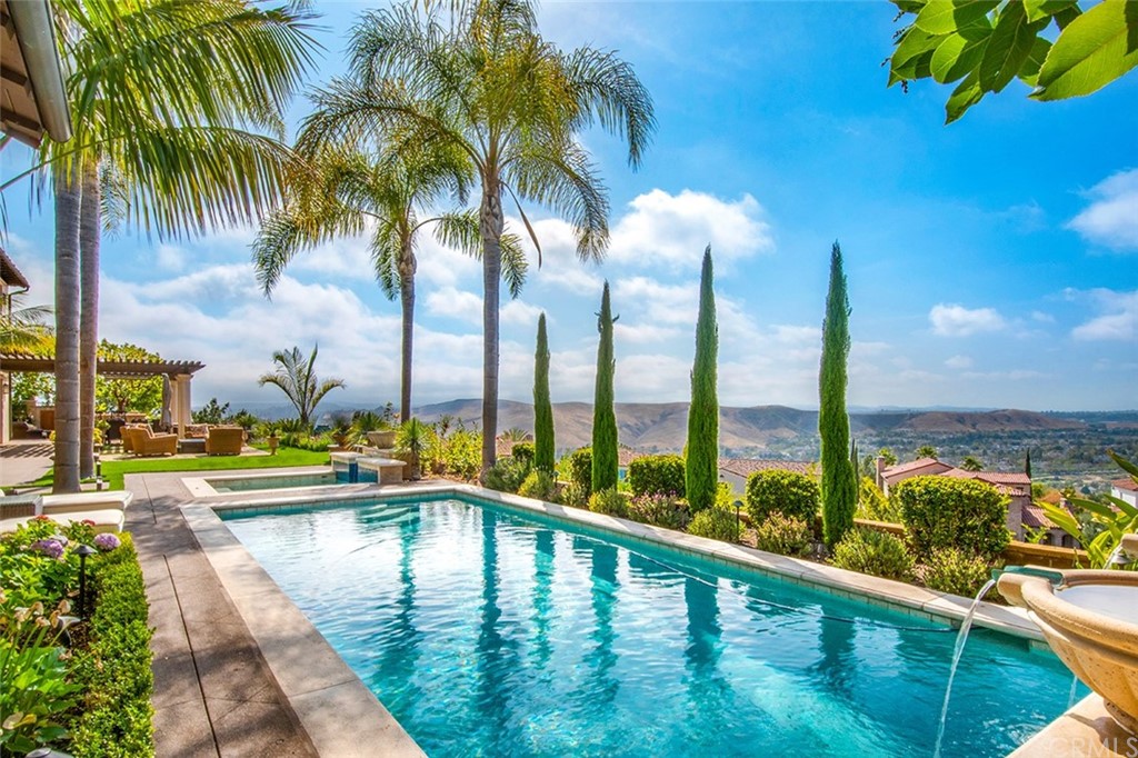 a view of swimming pool with outdoor seating