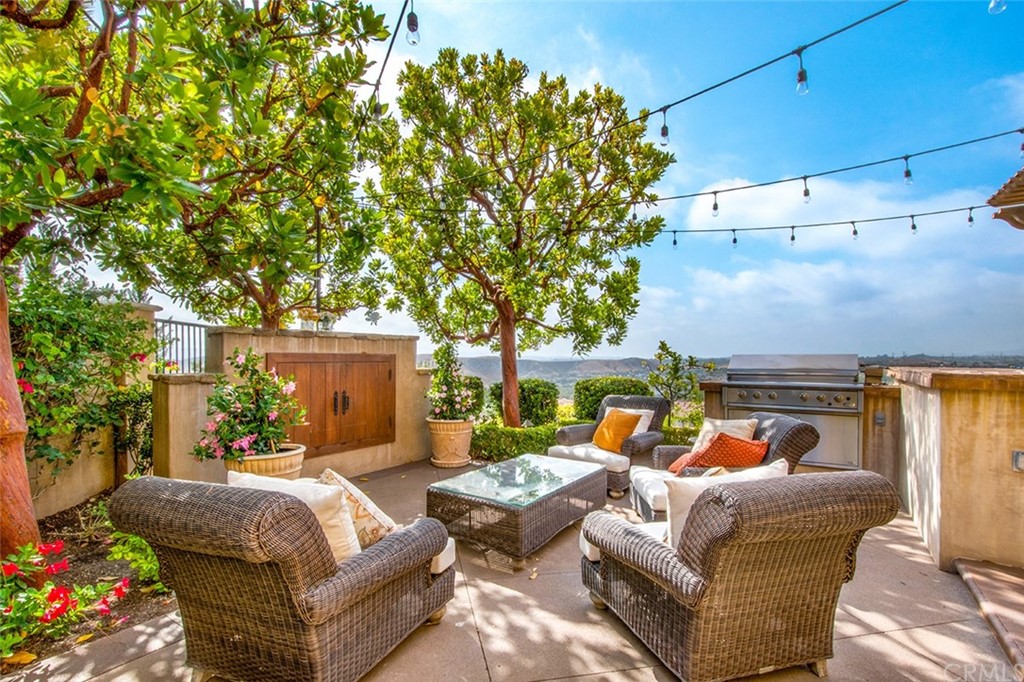 1 Thomas Road Ladera Ranch, CA 92694 - Photo 13 of 25 a outdoor living space with furniture and a fireplace
