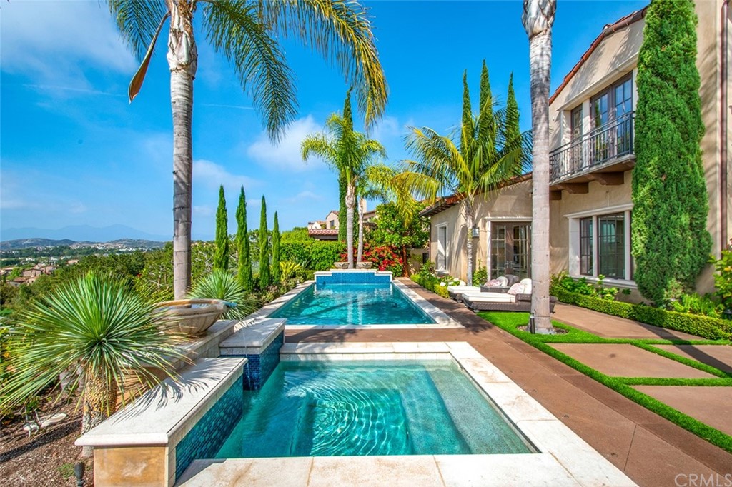 1 Thomas Road Ladera Ranch, CA 92694 - Photo 19 of 25 a view of backyard with couches and swimming pool