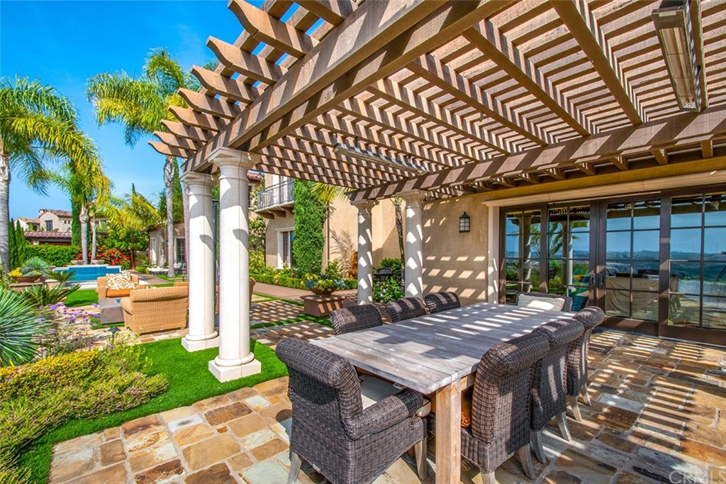 1 Thomas Road Ladera Ranch, CA 92694 - Photo 21 of 25 a view of a backyard with a patio and outdoor seating