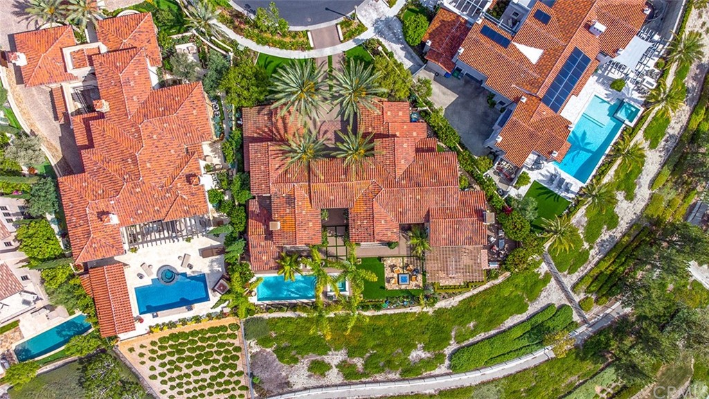 1 Thomas Road Ladera Ranch, CA 92694 - Photo 24 of 25 an aerial view of a house with a yard and potted plants