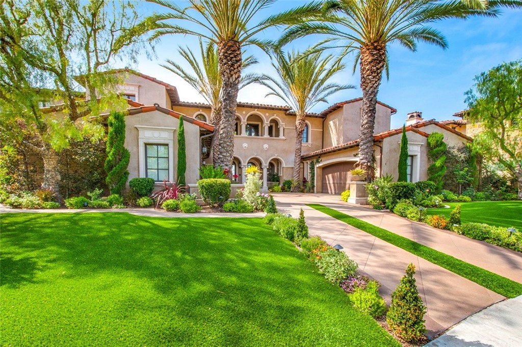 1 Thomas Road Ladera Ranch, CA 92694 - Photo 6 of 25 a front view of a house with a garden and plants