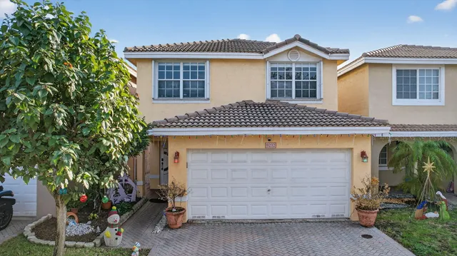 a front view of a house with a garage