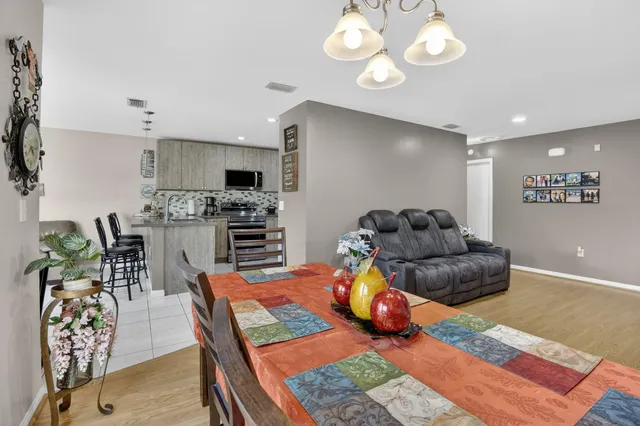 a living room with furniture fireplace and a flat screen tv
