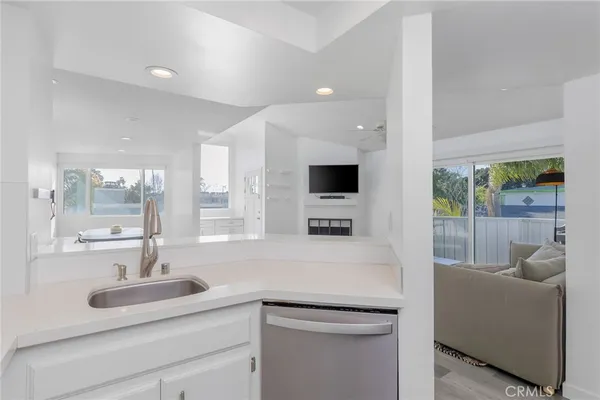 a kitchen with furniture and a sink