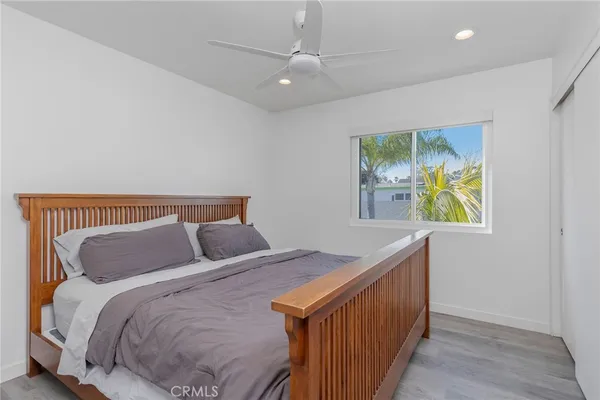 a white toilet sitting next to a shower