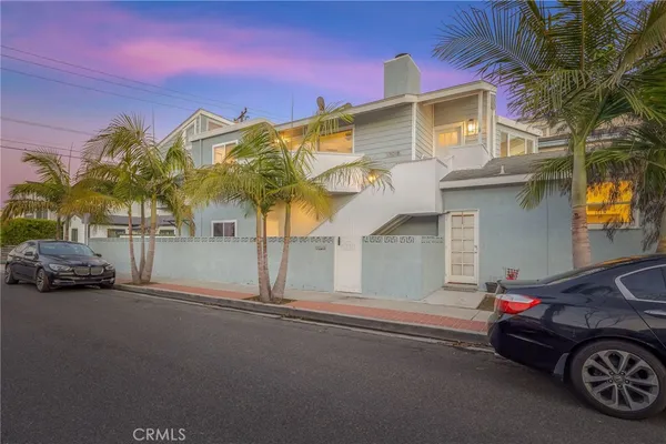 a view of a car park in front of a house