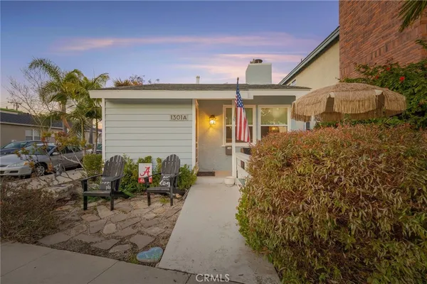 a view of a patio with couches and a fire pit