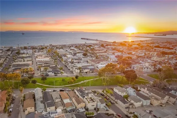 an aerial view of residential building and ocean