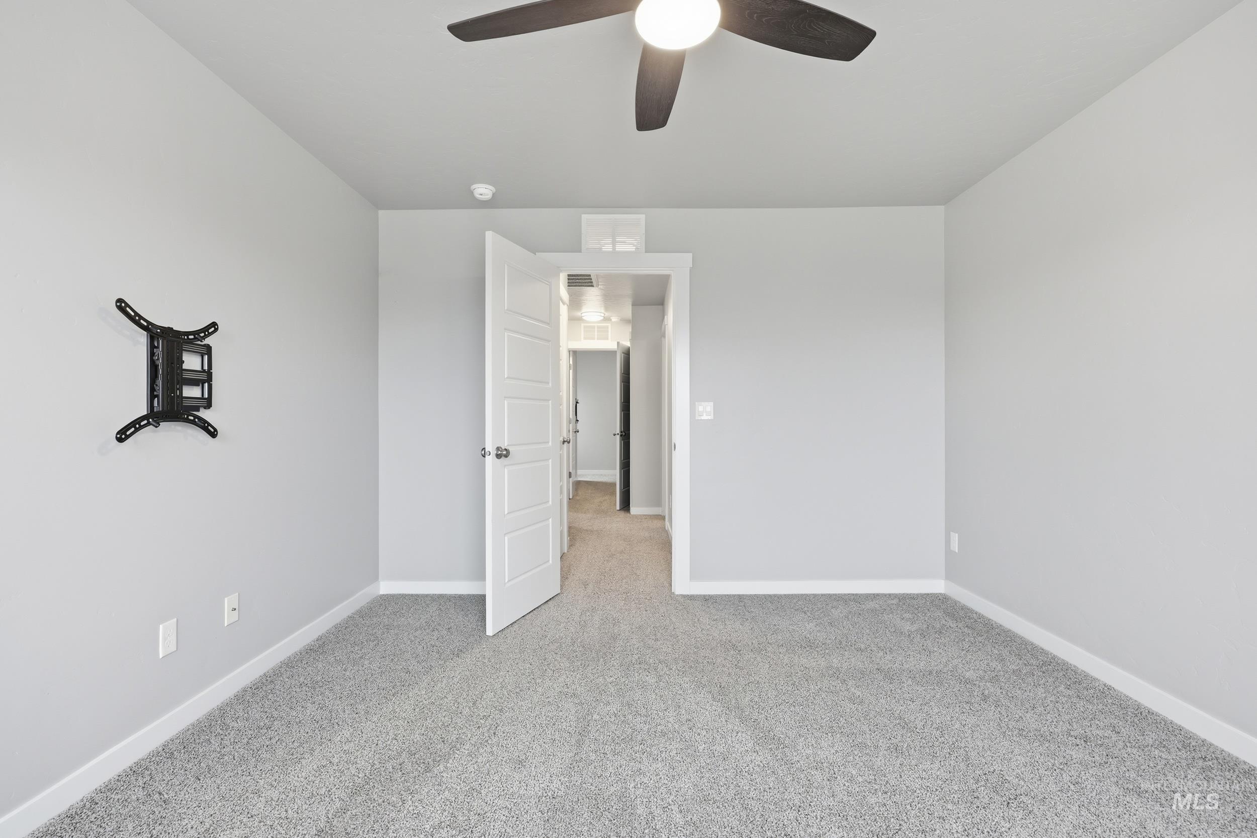 1097 North World Cup Lane Eagle, ID 83616 - Photo 27 of 42 Unfurnished bedroom with light colored carpet and a ceiling fan