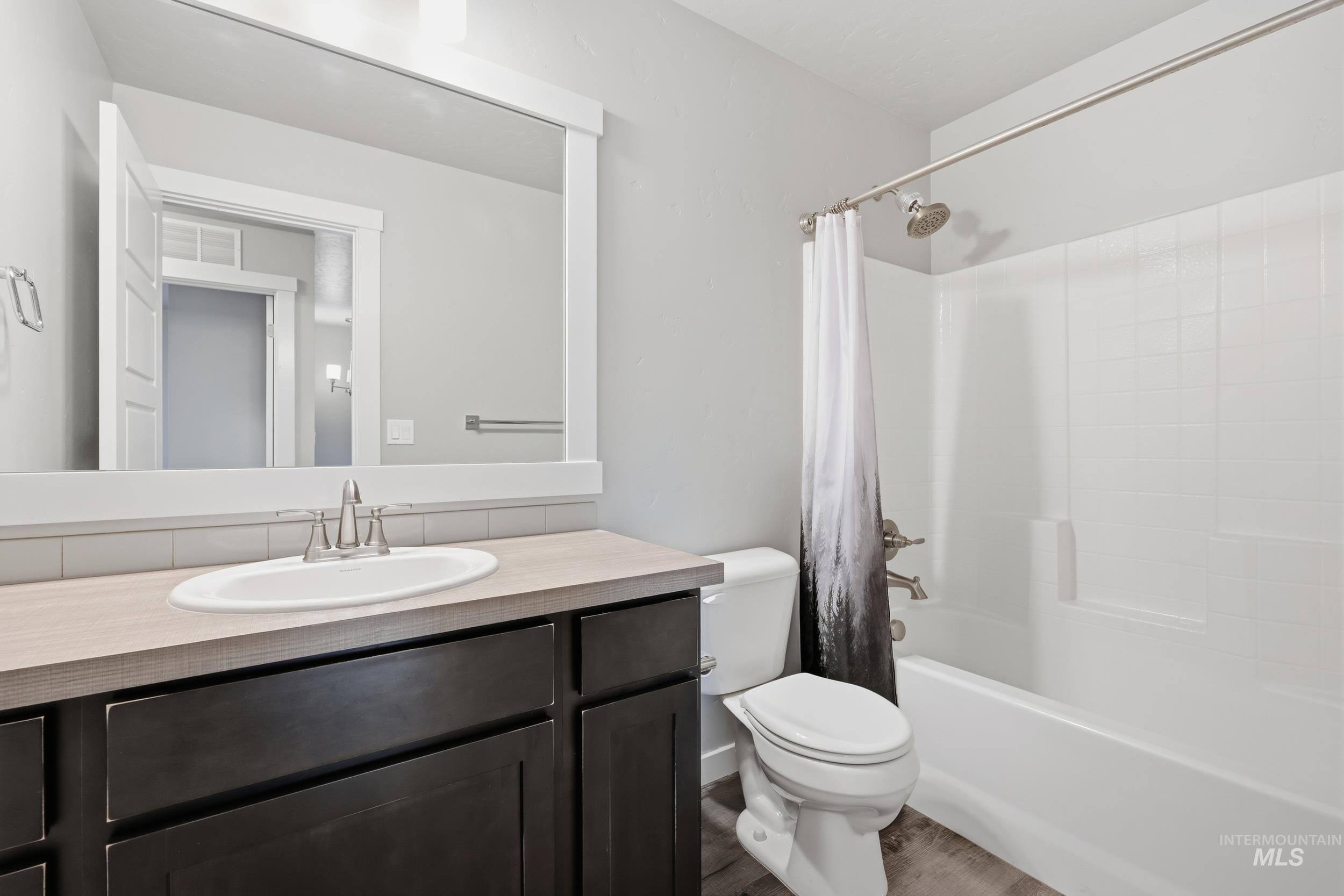 1097 North World Cup Lane Eagle, ID 83616 - Photo 29 of 42 Bathroom featuring vanity and shower / bath combo