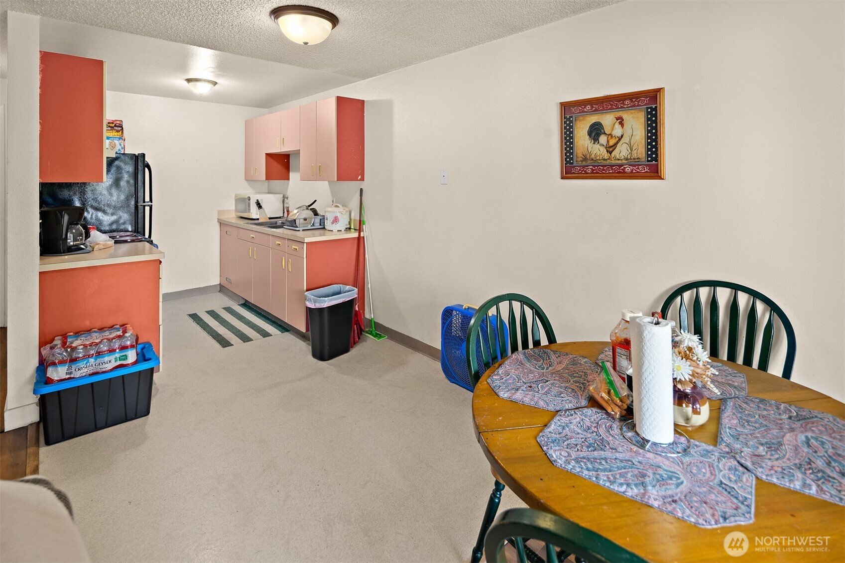739 3rd Avenue South Kent, WA 98032 - Photo 30 of 33 a kitchen with a dining table chairs and a counter top space