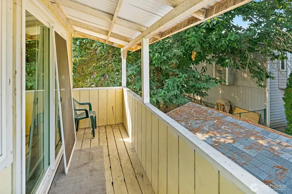 a view of balcony with furniture