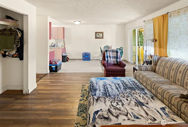 a bedroom with furniture and a large window